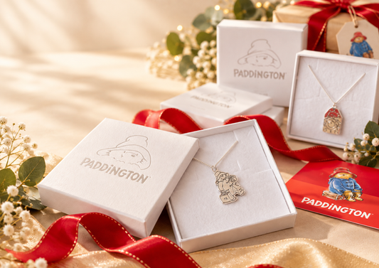 Paddington jewellery gifts presented in branded gift boxes with red ribbon, including officially licensed necklaces