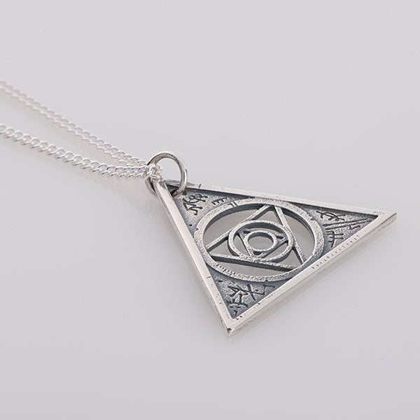 Handcrafted sterling silver Aughra's Triangle Necklace, featuring the Eye of the superimposed suns in a triangle design. Inspired by The Dark Crystal, perfect for collectors and fantasy fans.