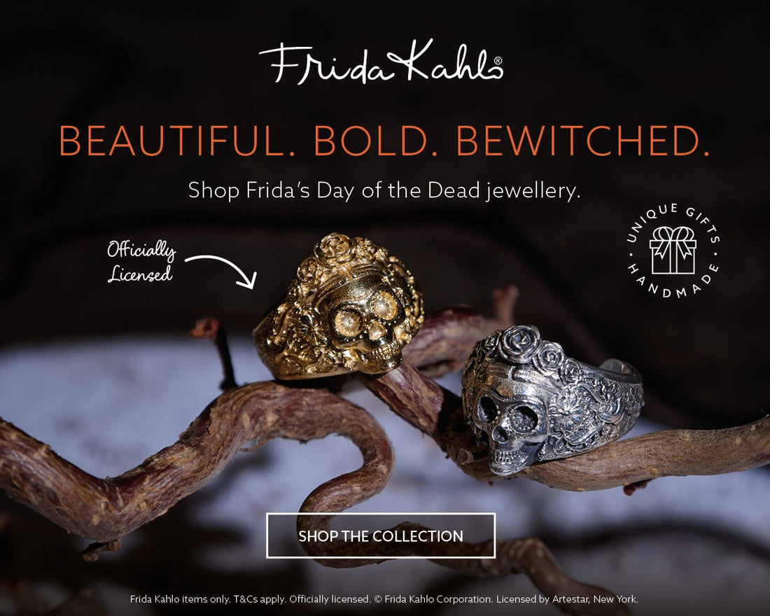 Frida Kahlo Sugar Skull rings in gold vermeil and sterling silver displayed on twisted branches, with headline text “Beautiful. Bold. Bewitched.” Celebrate Day of the Dead with Frida-inspired jewellery. Officially licensed, handmade gifts.