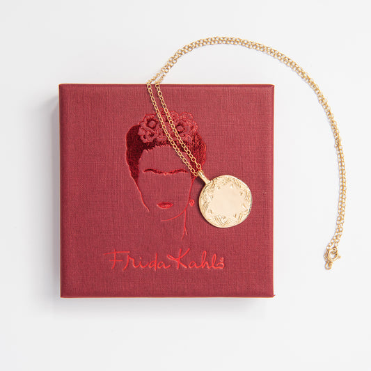 Handmade Frida Kahlo Necklace with intricate folk art engraving. Gold vermeil disc design inspired by her cultural heritage.
