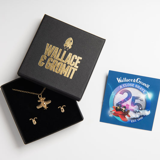 Gromit’s Delightful Duo Jewellery Gift Set in 18ct Gold Vermeil, featuring Gromit Dog Stud Earrings and Gromit in a Plane Necklace. A perfect Wallace & Gromit fan gift.