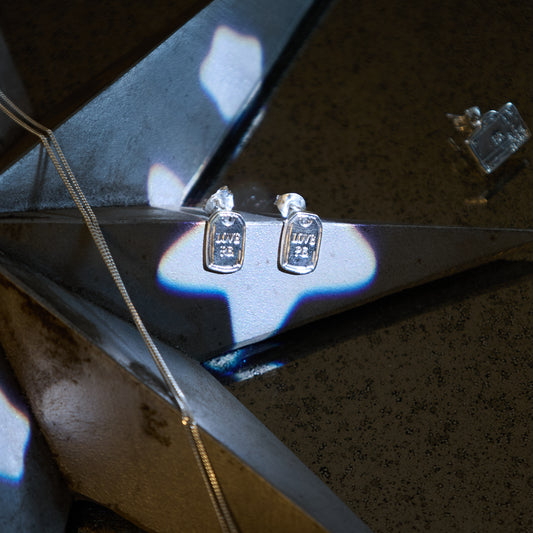 Paddington sterling silver Love PB earrings styled with Christmas décor, Licensed To Charm