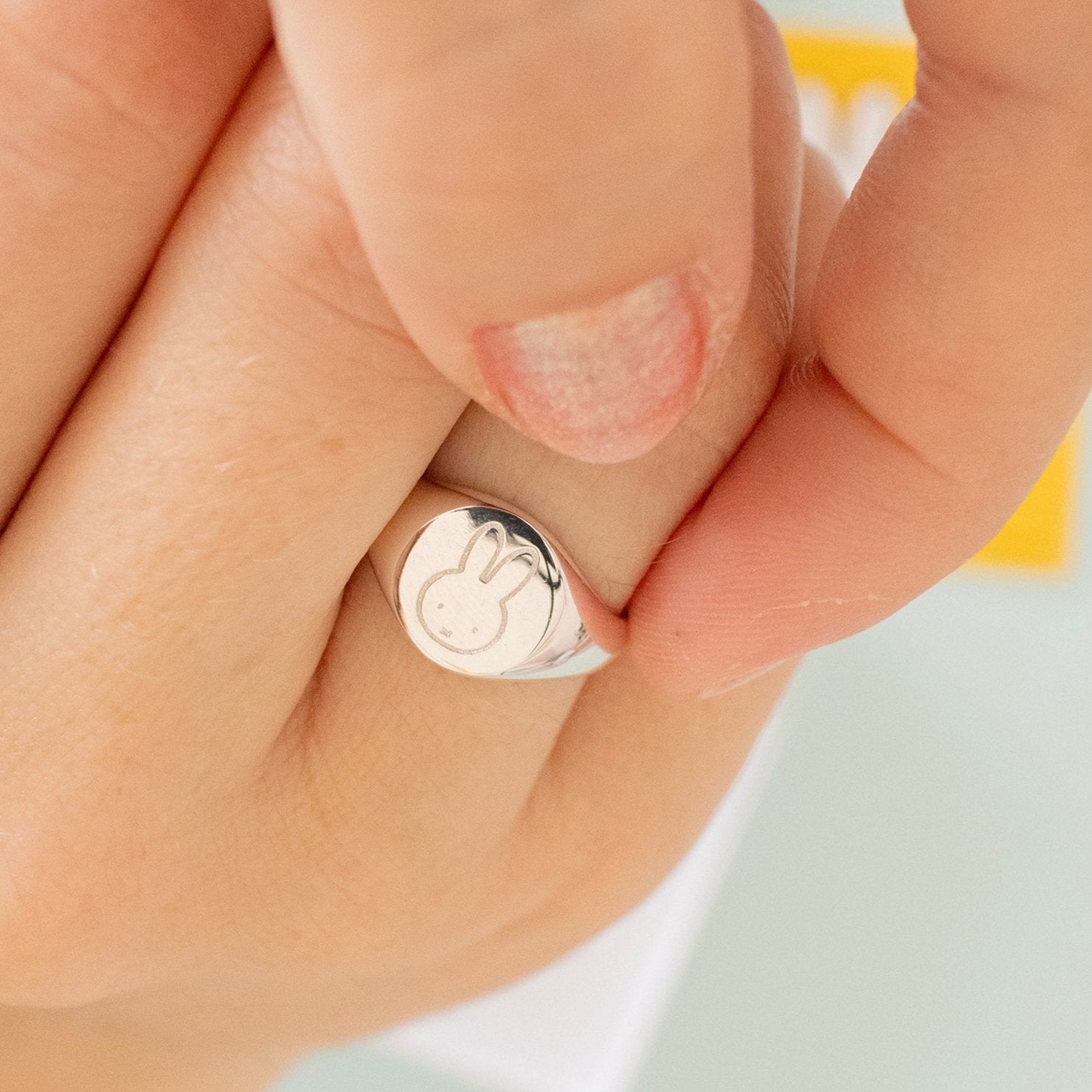 Licensed To Charm Handmade Miffy Signet Adjustable Ring in sterling silver with an adjustable fit and charming Miffy design worn by model. A perfect gift for Miffy fans