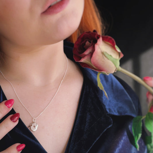 Licensed To Charm Model wearing Phantom of the Opera small mask necklace, elegant everyday look