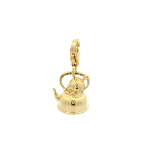 Close-up side view of Little My gold charm sitting in a teapot, showing 3D detail and her iconic topknot, handmade from recycled silver with 18ct gold vermeil