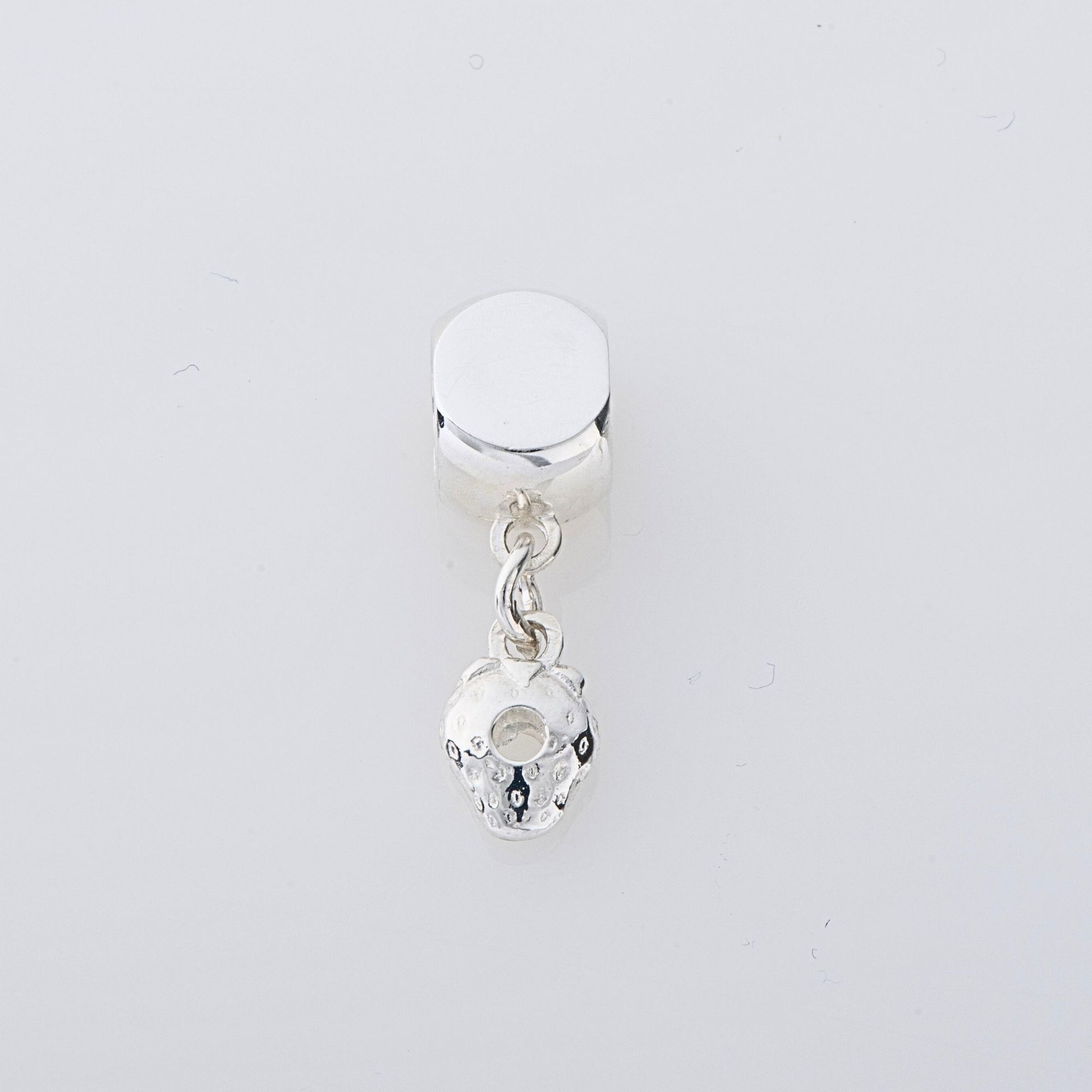 Sterling silver Very Hungry Caterpillar Strawberry Dangle Charm, a storybook-inspired keepsake, perfect for bracelets & necklaces.