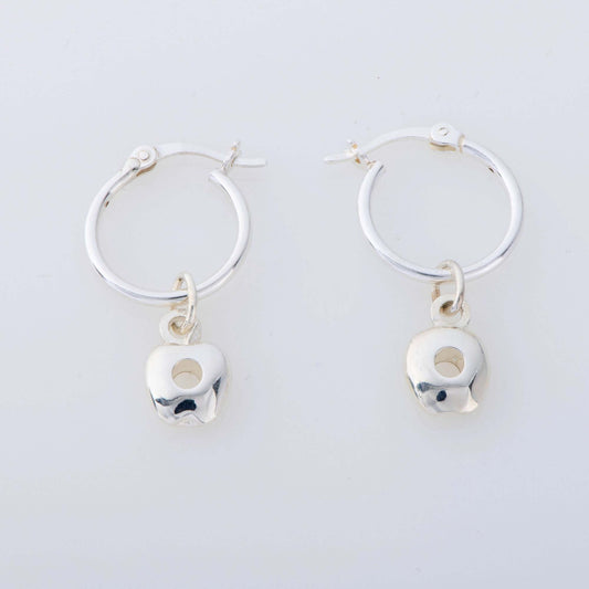 Sterling silver apple charm earrings inspired by The Very Hungry Caterpillar, dangling from hinged hoops. A playful and nostalgic accessory for book lovers.