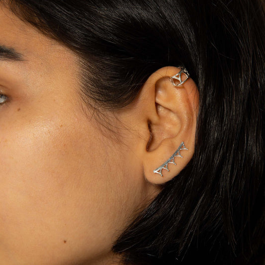 Sterling silver Jubilee Crown Ear Climbers inspired by Queen Elizabeth II’s tiara, showcasing delicate swag and finial detailing.