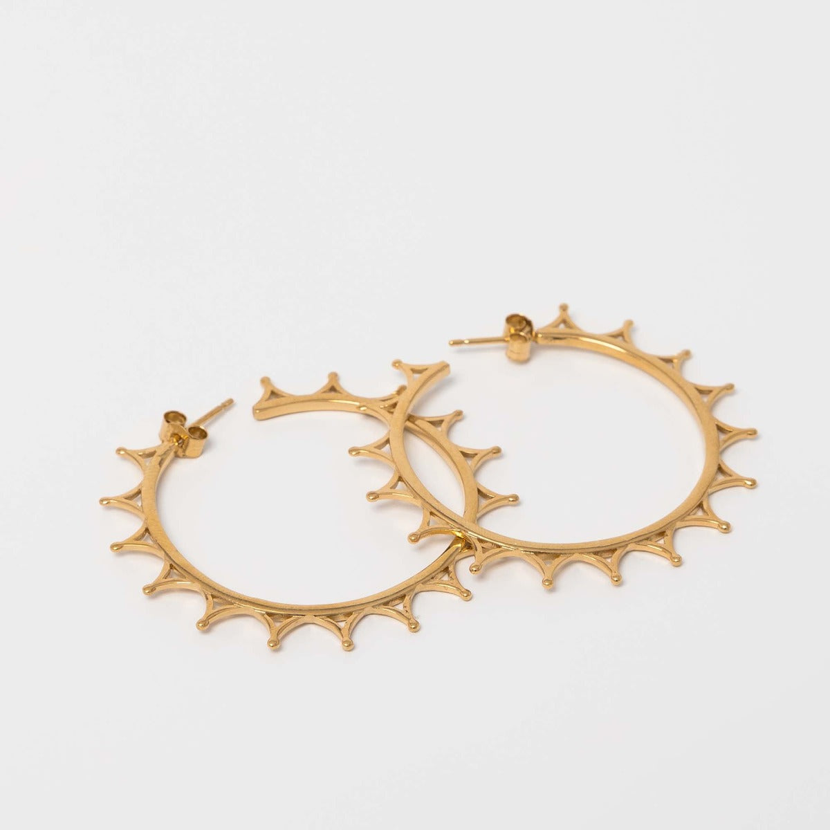 Front view of the Crown Hoop Earrings in 18ct gold vermeil, featuring an intricate tiara-inspired crown motif.