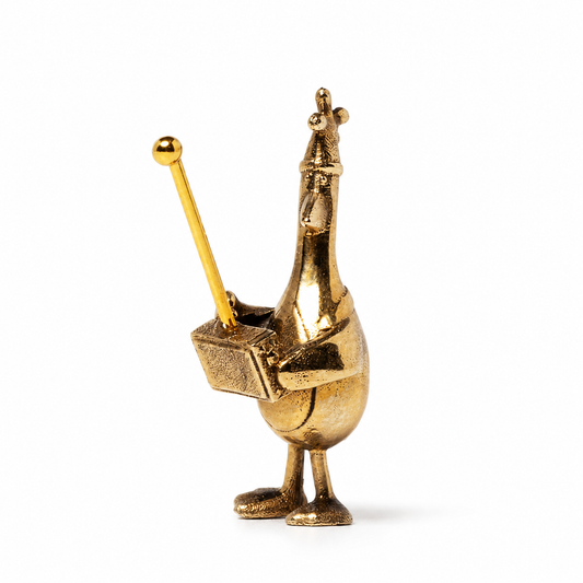 Front view of Feathers McGraw miniature bronze figurine holding the remote control from Wallace & Gromit.