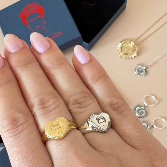 Frida Kahlo ring displayed in signature navy blue gift box with red illustration and matching necklace pieces