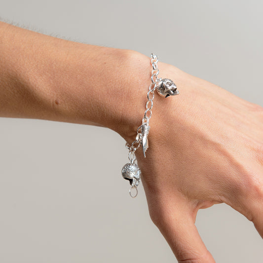 Handmade sterling silver Skull Charm Bracelet with gothic-inspired charms, perfect for fans of Frida Kahlo and edgy jewellery
