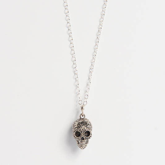 Front-facing view of the Frida Kahlo Aztec Skull Necklace in sterling silver, showcasing the intricate skull design inspired by traditional Mexican motifs.
