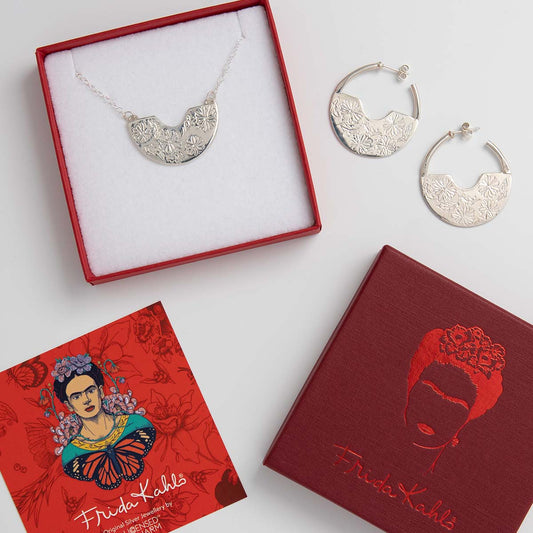 Frida Kahlo Silver Reverie Necklace & Earring Gift Set with marigold flower engravings, handcrafted from sterling silver and presented in a Frida Kahlo gift box.