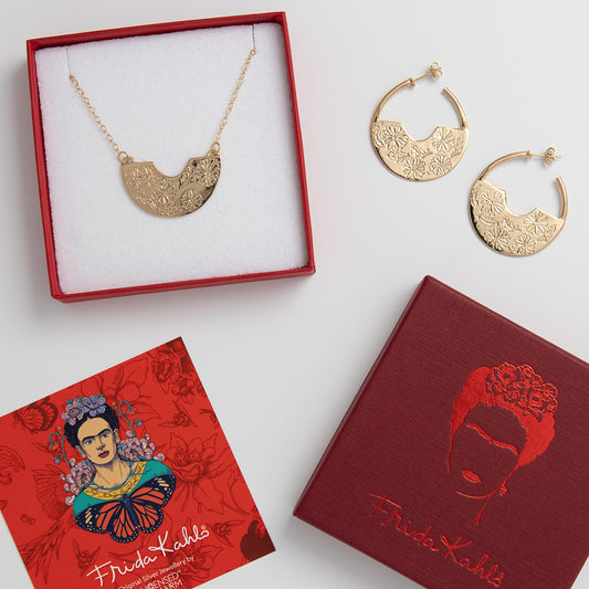 Frida Kahlo Marigold Necklace & Hoop Earrings Set in 18ct Gold Vermeil, featuring intricate marigold engravings, presented in vibrant Frida Kahlo packaging.