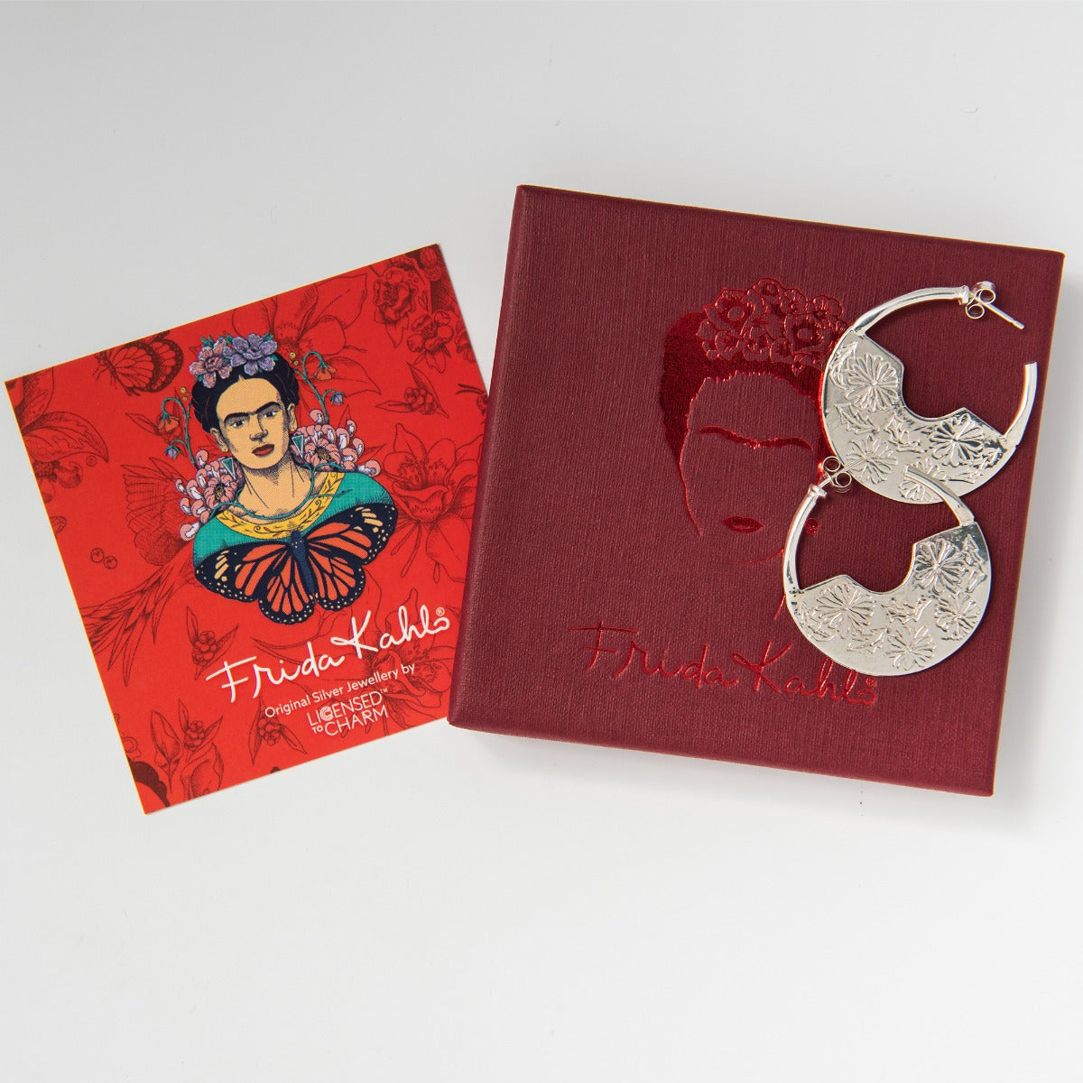 Handmade sterling silver Frida Kahlo Hoop Earrings with marigold etching. Bold yet feminine design for any occasion.
