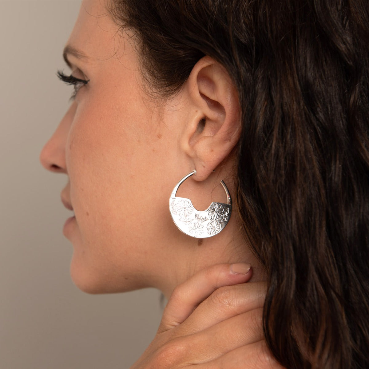 Frida Kahlo Marigold Hoop Earrings in sterling silver, featuring etched floral details. Handcrafted bohemian jewellery for pierced ears.