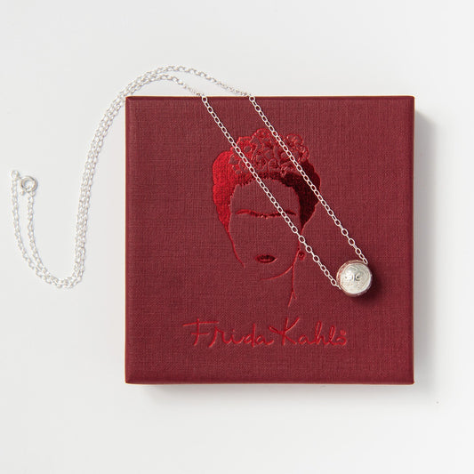 Front-facing view of the Frida Kahlo Round Carved Bead Necklace in sterling silver, showcasing the delicate floral-inspired bead pendant on a fine chain.