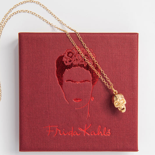 Close-up of the gold vermeil Calavera Skull Necklace pendant, showcasing the intricate engraving inspired by Day of the Dead symbolism.