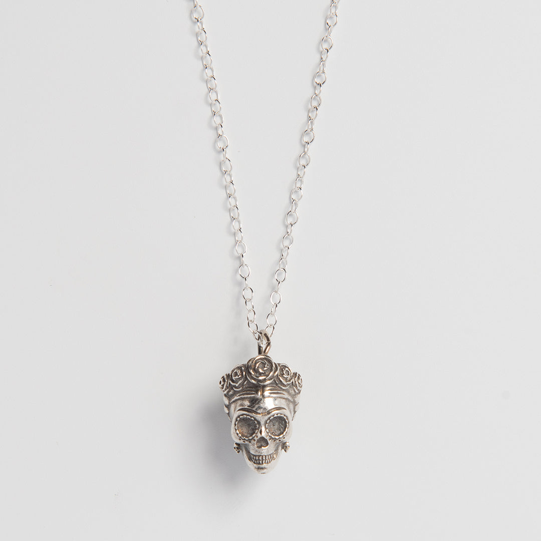 Front-facing view of the Frida Kahlo Sugar Skull Necklace in recycled sterling silver, featuring Frida’s iconic floral crown and facial features.