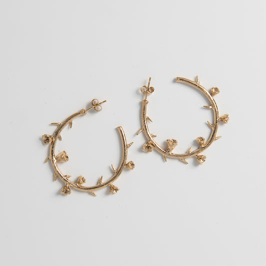 Front-facing view of the Frida Kahlo Thorn Hoop Earrings in 18ct gold vermeil, showcasing the sculptural thorn detailing and elegant hoop shape.