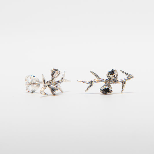 Front-facing view of the Frida Kahlo Thorn Stud Earrings in sterling silver, featuring a sculptural thorn design inspired by Frida’s self-portrait.