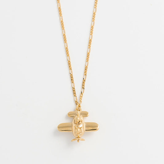 Gromit in a Plane Necklace in 18ct gold vermeil, featuring intricate details and movable propellers. A playful tribute to Wallace & Gromit’s A Close Shave.