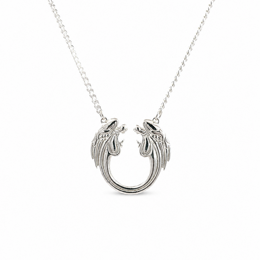Sterling silver Jesus Christ Superstar logo necklace on a chain, photographed on a clean white background