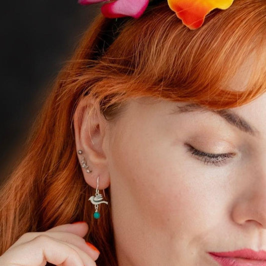 Licensed To Charm Frida Kahlo bird turquoise drop earrings in sterling silver, handmade in the UK-model