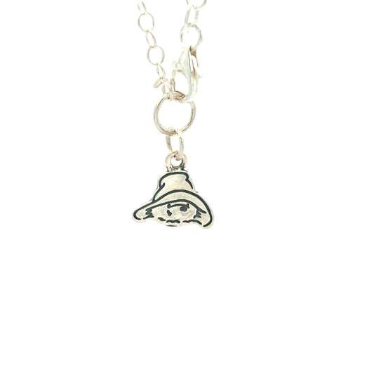 Licensed To Charm Paddington head charm close-up — sterling silver with oxidised engraved detail on bracelet