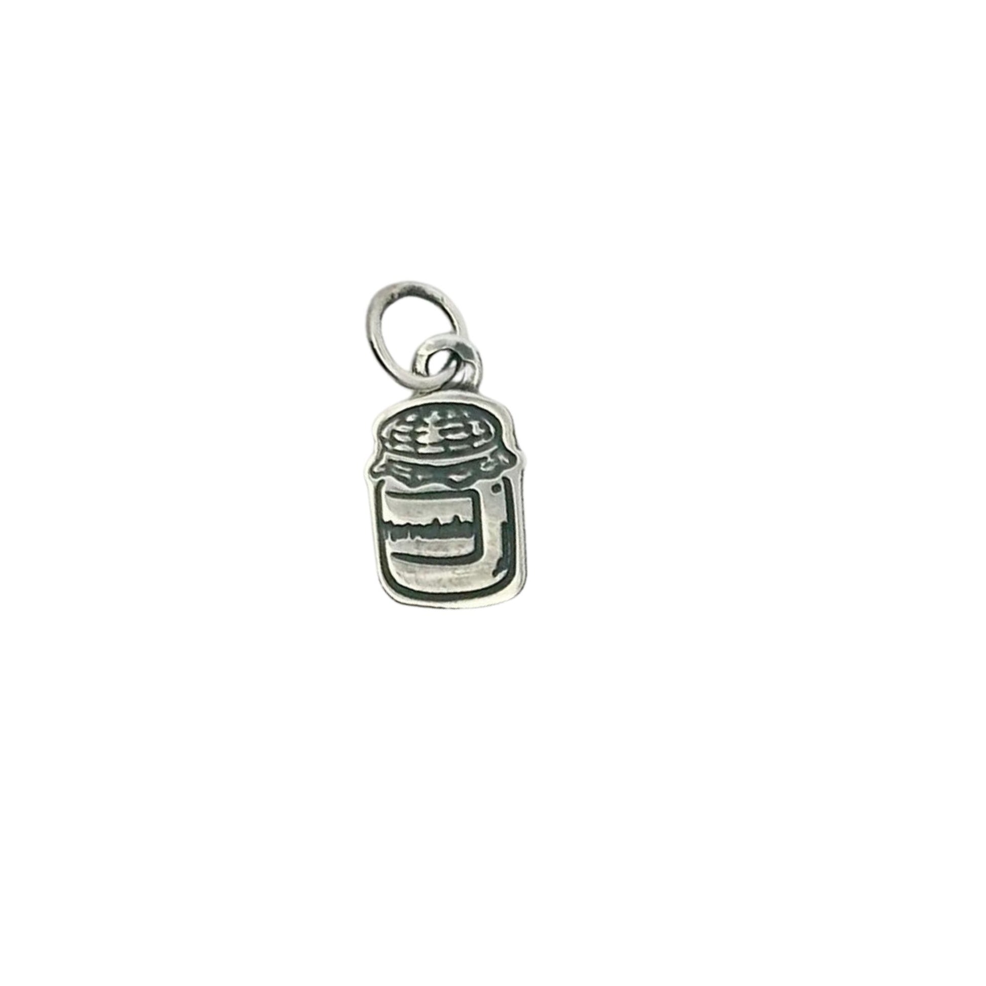 Licensed To Charm Silver charm shaped like a marmalade jar with a lid on a white background