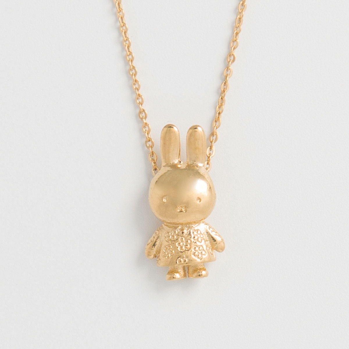 Adorable Miffy Daisy Charm Necklace, handcrafted from recycled sterling silver and gold vermeil. A whimsical accessory for Miffy lovers.