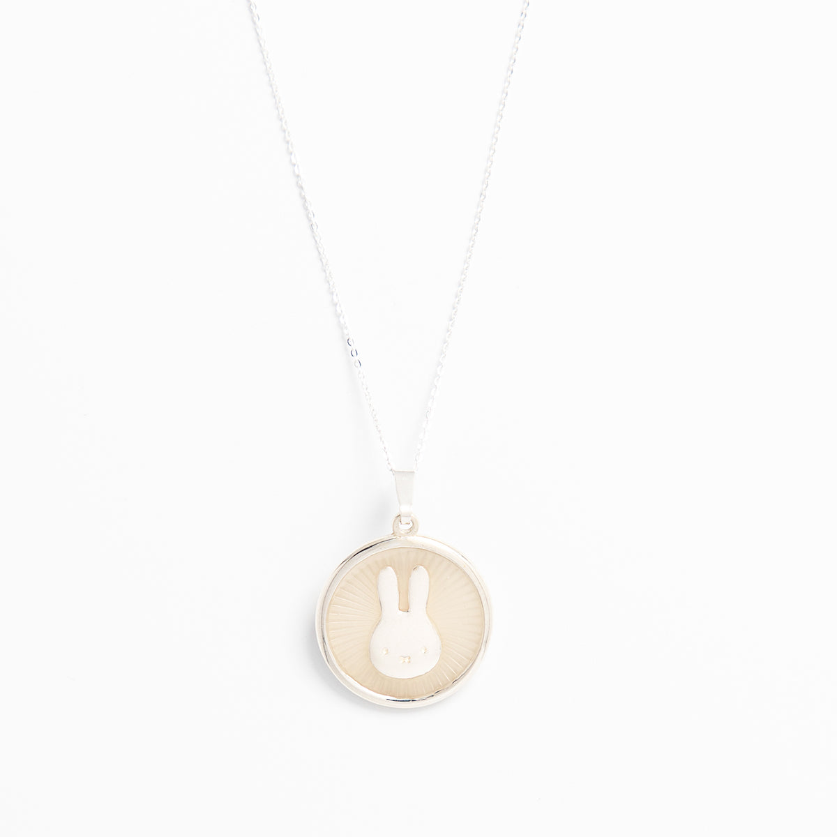 Miffy White Enamel Disc Necklace in sterling silver, featuring Miffy’s silhouette on a crisp white enamel disc. A playful and elegant accessory.