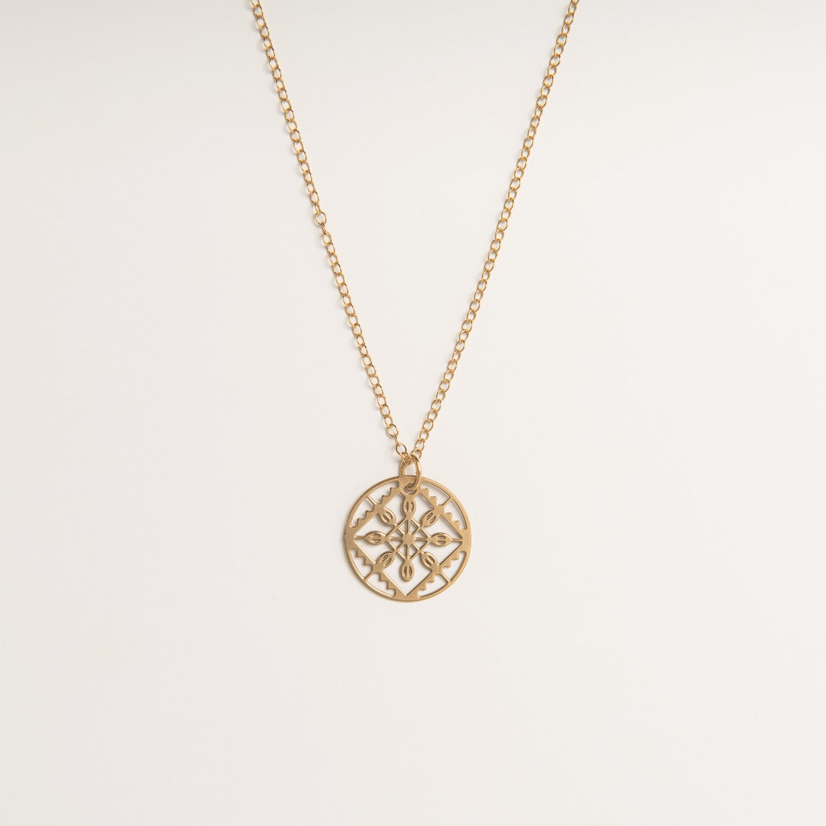 Front-facing view of the Lace Necklace in 18ct gold vermeil, featuring a delicate lace-etched pendant inspired by Elizabethan fashion.
