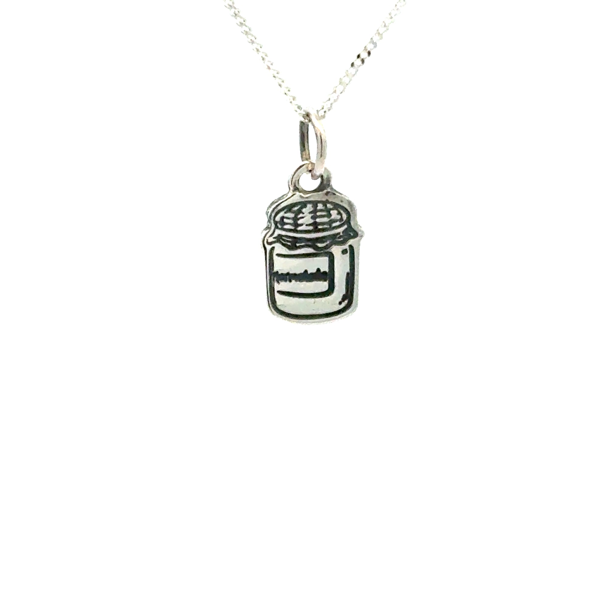 Sterling silver Paddington™ Marmalade Jar Necklace showing engraved detail and oxidised finish