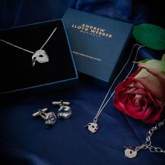 Licensed To Charm Phantom mask charm clipped to silver bracelet, lifestyle image showing the whole collection.