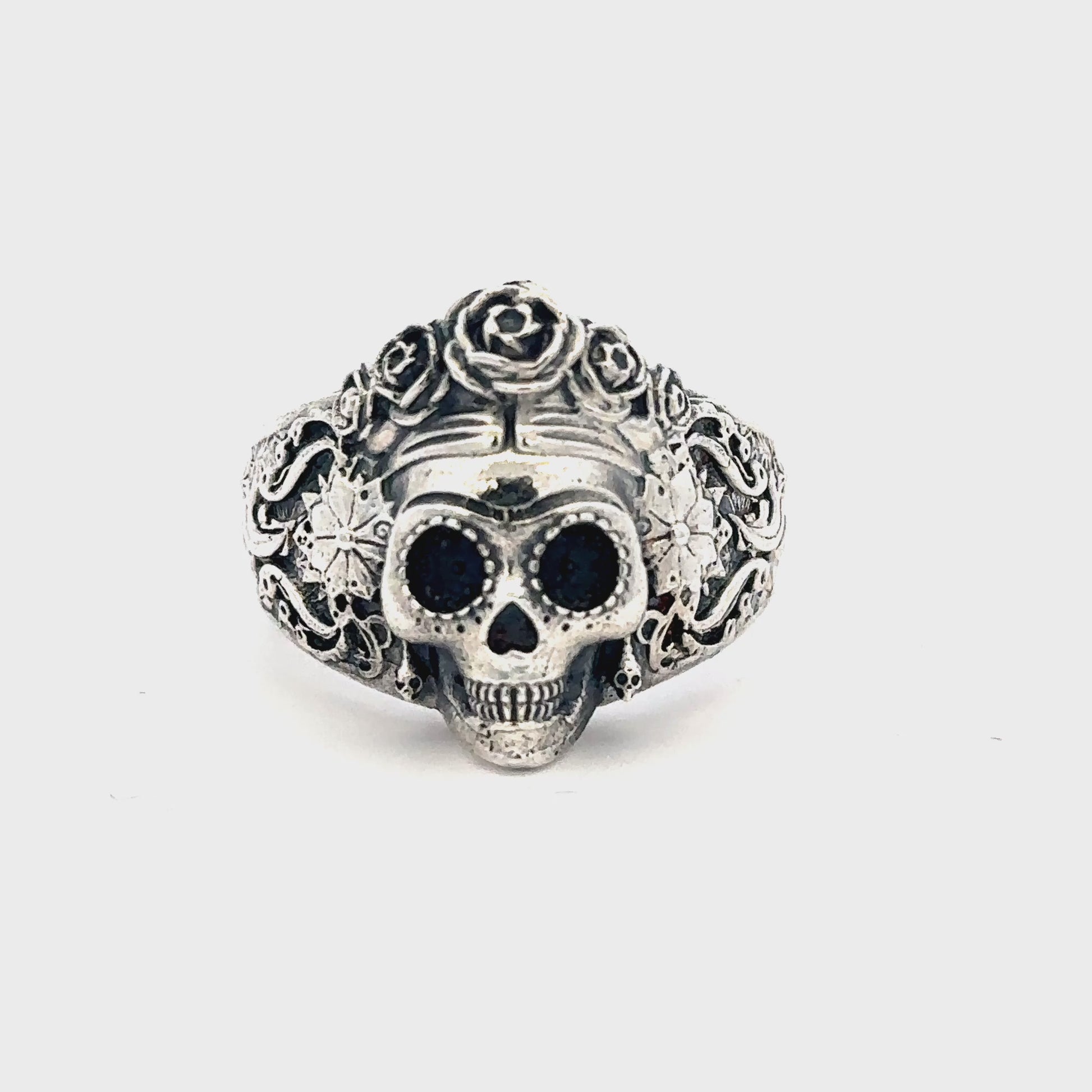 Licensed To Charm Frida Kahlo Sugar Skull Ring close-up of skull and rose design turn around