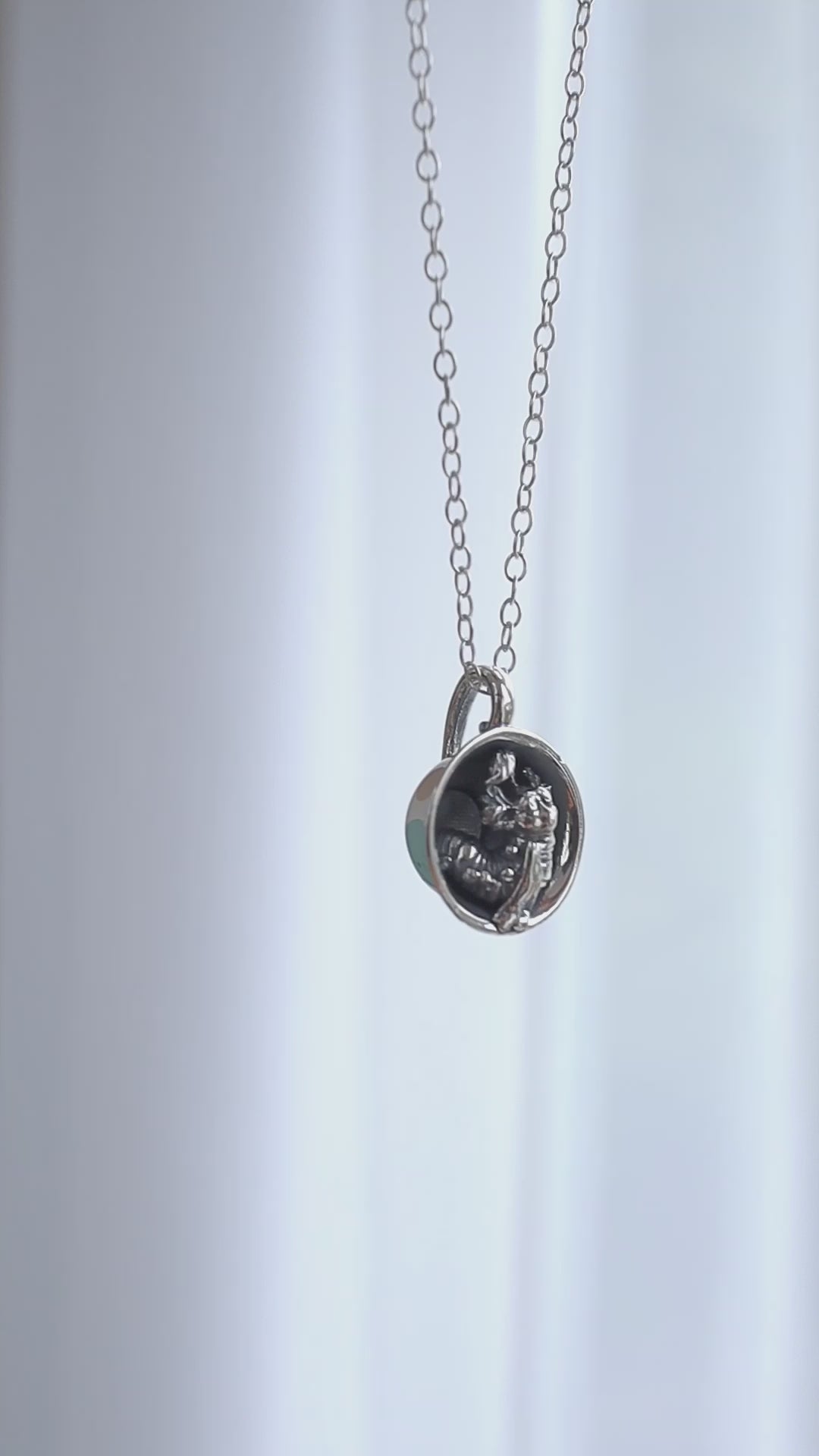 Licensed To Charm detailed view of Labyrinth Worm in a Cup Necklace handmade from sterling silver.