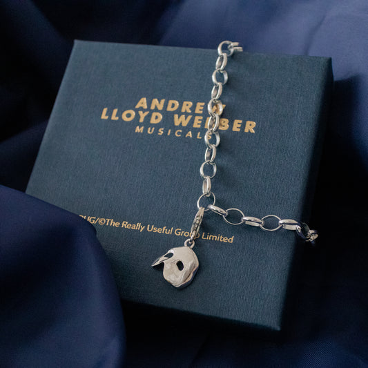 Delicate sterling silver Phantom of the Opera mask bracelet, handmade in the UK. A timeless, theatre-inspired accessory for fans of Andrew Lloyd Webber’s musical.