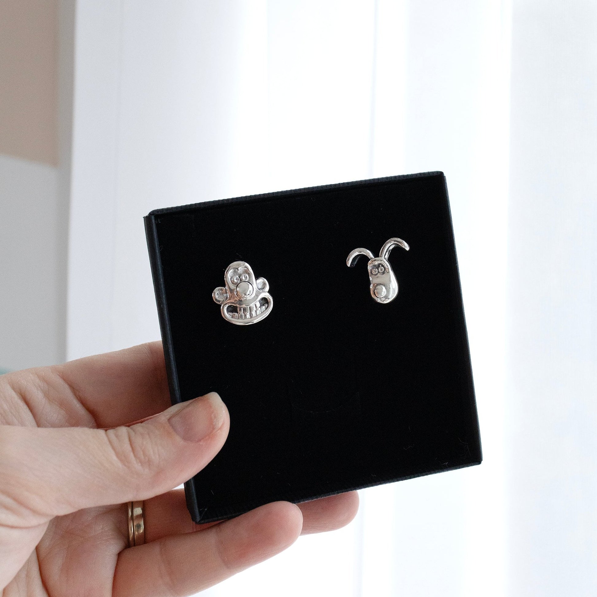 Eco-friendly sterling silver cufflinks of Wallace and Gromit characters.