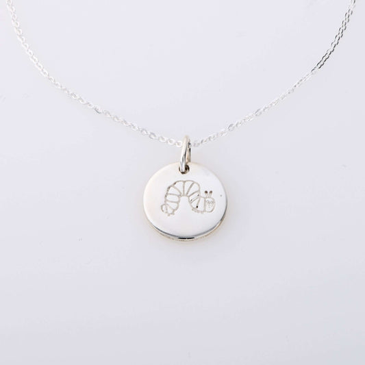 Sterling silver The Very Hungry Caterpillar Small Disc Necklace, a handmade literary-inspired pendant, perfect for mums, daughters & book lovers.