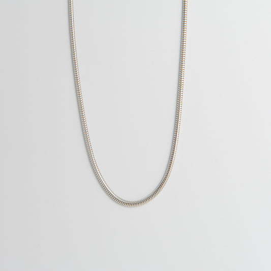 Front-facing view of the Sterling Silver Snake Chain Necklace, showcasing its distinctive zig-zag pattern and fluid silver links.