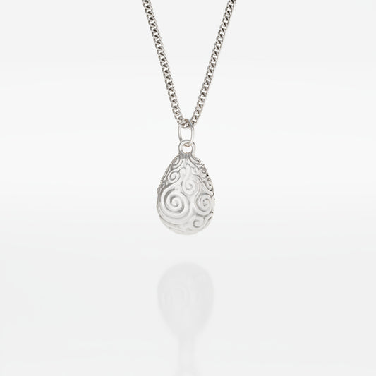 Mystic Valley Pebble Necklace in recycled sterling silver, inspired by The Dark Crystal. Features an intricately etched pebble-shaped pendant, echoing the harmony of the urRu’s valley. Comes on an 18-inch chain.