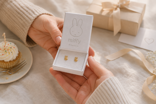 Gold Miffy stud earrings presented in an open white Miffy jewellery box as a thoughtful birthday gift.