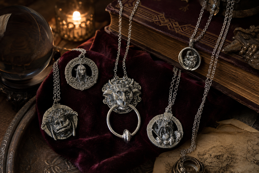 Official Labyrinth 40th Anniversary jewellery by Licensed to Charm, featuring three detailed character-inspired necklaces and earrings in a dark fantasy setting