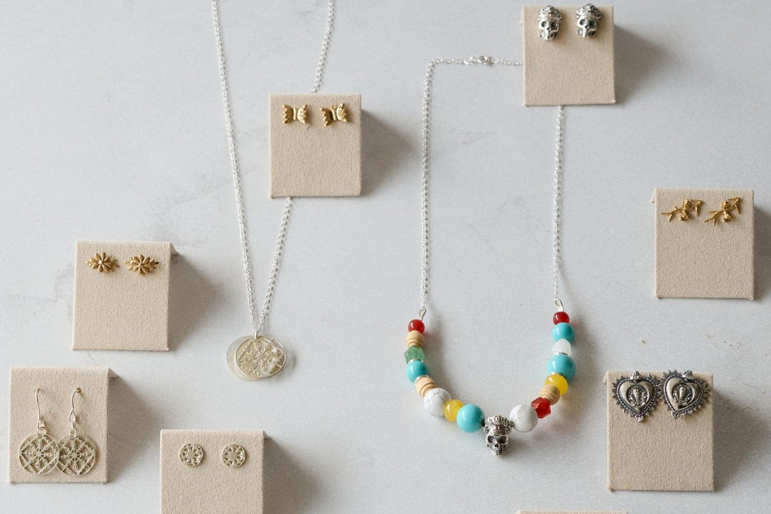 Licensed To Charm handmade jewellery gifts including sterling silver necklace, beaded necklace and earrings styled on gift boxes, perfect for meaningful gifting