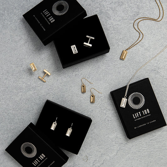 Elegant jewelry pieces from the Lift 109 Collection, inspired by the iconic Battersea Power Station, showcasing British craftsmanship and design.