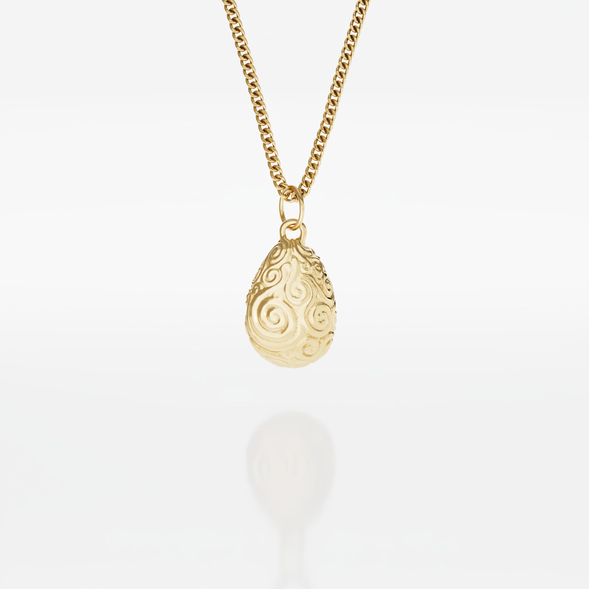 Mystic Valley Pebble Necklace in 18ct gold vermeil, inspired by The Dark Crystal. Features a pebble-shaped pendant with intricate etched spirals, symbolising the tranquil home of the urRu. Suspended on an 18-inch chain