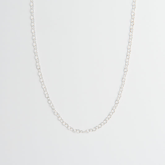 Front-facing view of the Sterling Silver Trace Chain Necklace, showcasing its fine, delicate link design and minimalist style.