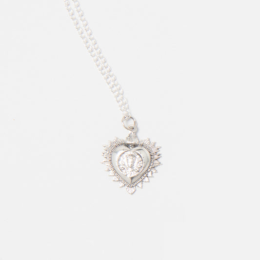 Sterling silver Frida Kahlo Viva La Vida Small Heart Necklace featuring a sacred heart design with floral details and Frida’s portrait.